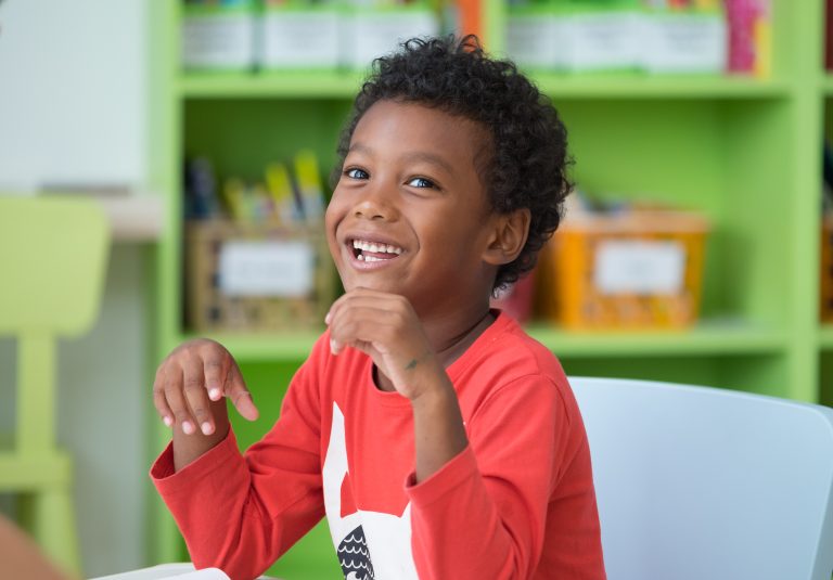 Child laughing at camera