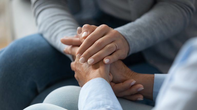 Couple holding hands